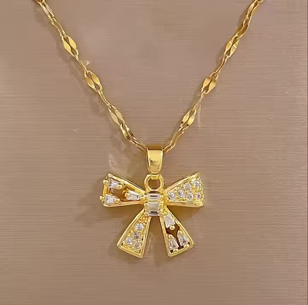 Gold bow-shaped pendant necklace | Ivor Jewels